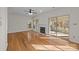 Living room with hardwood floors, fireplace, and sunroom access at 9600 Kayce Ln, Charlotte, NC 28213