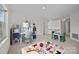 Playroom with built-in shelving and playful rug at 9600 Kayce Ln, Charlotte, NC 28213