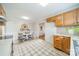 Bright kitchen with wood cabinets and an adjacent dining area at 1300 Rama Rd, Charlotte, NC 28211