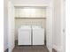 Convenient laundry room with washer, dryer, and overhead cabinets at 1317 Downs Ave, Charlotte, NC 28205