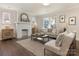 Cozy living room with a white brick fireplace and hardwood floors at 1317 Downs Ave, Charlotte, NC 28205