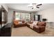 Comfortable living room with two leather couches and a large TV at 1365 Kings Bottom Dr, Fort Mill, SC 29715