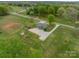 Aerial view of home, carport, shed, expansive lawn, and mature trees on a large parcel of land at 1410 Mays Chapel Church Rd, Newton, NC 28658