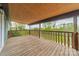 Expansive wood balcony offering stunning views of the surrounding treeline and property at 1410 Mays Chapel Church Rd, Newton, NC 28658