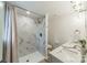 Bright bathroom with tiled shower, modern vanity, and updated fixtures at 1410 Mays Chapel Church Rd, Newton, NC 28658