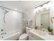 Bathroom featuring a tub with a shower and a vanity with updated fixtures at 1410 Mays Chapel Church Rd, Newton, NC 28658