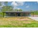 Charming one-story brick home featuring large front porch with wooden pillars and beautifully landscaped yard at 1410 Mays Chapel Church Rd, Newton, NC 28658