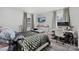Comfortable bedroom with a plush bed, work desk, and large windows at 1449 Cherryville Rd, Shelby, NC 28150