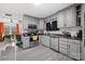 Spacious kitchen with gray cabinets, stainless steel appliances, and granite countertops at 1449 Cherryville Rd, Shelby, NC 28150