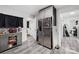 Stainless steel refrigerator in a kitchen with gray cabinets and wood-look flooring at 1449 Cherryville Rd, Shelby, NC 28150