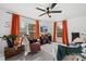 Living room with orange curtains, a comfy recliner and large windows at 1449 Cherryville Rd, Shelby, NC 28150