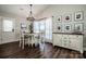 Bright dining room features a table with four chairs, a buffet, and large windows at 148 Tarrington Dr, Statesville, NC 28625