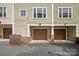 Two-car garage with brown doors and brick accents at 1733-C Matheson Ave, Charlotte, NC 28205