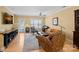 Open living room with hardwood floors and access to balcony at 1733-C Matheson Ave, Charlotte, NC 28205