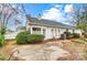 Home's backyard with patio and mature shrubs at 1749 Ridgefield Ct, Rock Hill, SC 29732