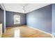 Light-filled bedroom with hardwood floors and ceiling fan at 1749 Ridgefield Ct, Rock Hill, SC 29732