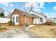 Brick and white sided home with a small yard and driveway at 1749 Ridgefield Ct, Rock Hill, SC 29732