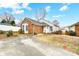 Brick and white sided home with a small yard and driveway at 1749 Ridgefield Ct, Rock Hill, SC 29732