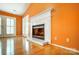 White fireplace in a living room with orange walls at 1749 Ridgefield Ct, Rock Hill, SC 29732