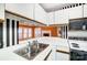 Kitchen with white cabinets, stainless steel sink, and stove at 1749 Ridgefield Ct, Rock Hill, SC 29732