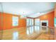 Spacious living room with hardwood floors, fireplace, and a chandelier at 1749 Ridgefield Ct, Rock Hill, SC 29732