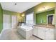 Spacious bathroom features a soaking tub, double sinks, granite countertops, and green wall at 2214 Brandybuck Ct, Fort Mill, SC 29715