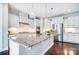 Modern kitchen featuring a large island, stainless steel appliances, and beautiful pendant lighting at 2214 Brandybuck Ct, Fort Mill, SC 29715