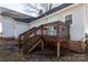 Wooden deck with stairs leading to the backyard at 298 Misenheimer Nw Dr, Concord, NC 28025