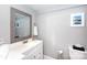 Clean bathroom with white vanity and a frameless mirror at 298 Misenheimer Nw Dr, Concord, NC 28025