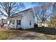 Charming white house with a front porch and rocking chairs at 298 Misenheimer Nw Dr, Concord, NC 28025