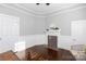 Living room with hardwood floors and a corner fireplace at 298 Misenheimer Nw Dr, Concord, NC 28025