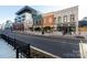 Modern and historic buildings line a city street, showcasing a mix of architectural styles at 298 Misenheimer Nw Dr, Concord, NC 28025