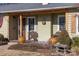 Ranch home exterior with covered porch and brick accents at 4436 Tilley Morris Rd, Matthews, NC 28105