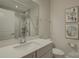 Modern bathroom with a large vanity and walk-in shower at 45528 Misty Bluff Dr, Charlotte, NC 28278
