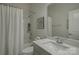 Clean bathroom with white vanity, quartz countertop, and shower/tub combo at 45528 Misty Bluff Dr, Charlotte, NC 28278