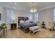 Main bedroom with king-size bed, hardwood floors, and plantation shutters at 45528 Misty Bluff Dr, Charlotte, NC 28278