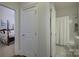 View of bedroom and bathroom with elegant decor and hardwood floors at 45528 Misty Bluff Dr, Charlotte, NC 28278
