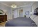 Bright main bedroom with king bed and access to other rooms at 45528 Misty Bluff Dr, Charlotte, NC 28278