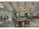 Community room with tables, chairs, and chandeliers at 45528 Misty Bluff Dr, Charlotte, NC 28278