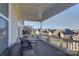 Relaxing deck with wicker furniture and neighborhood view at 45528 Misty Bluff Dr, Charlotte, NC 28278