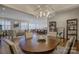 Open concept dining room with views into the living room and kitchen at 45528 Misty Bluff Dr, Charlotte, NC 28278