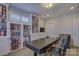 Bright home office features built-in bookshelves and a large desk at 45528 Misty Bluff Dr, Charlotte, NC 28278