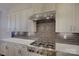 Modern kitchen with stainless steel range and custom cabinetry at 45528 Misty Bluff Dr, Charlotte, NC 28278