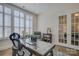 Home office with built-ins, hardwood floors, and natural light at 45528 Misty Bluff Dr, Charlotte, NC 28278