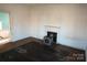 Simple bedroom with hardwood floors and fireplace at 507 Park Ave, Salisbury, NC 28144