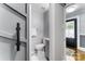 Modern bathroom with gray vanity and a barn door at 514 W 8Th Ave, Gastonia, NC 28052