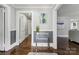 Elegant hallway with hardwood floors and a glass-top accent table at 514 W 8Th Ave, Gastonia, NC 28052