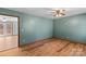 Bedroom with hardwood floors and access to another room at 539 Bethlehem Rd, Statesville, NC 28677