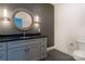 Bathroom boasts dark vanity, a large mirror, and gray tile floors at 5601 Fairview Rd # 22, Charlotte, NC 28209