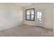 Bedroom with neutral carpeting and private balcony access at 5601 Fairview Rd # 22, Charlotte, NC 28209